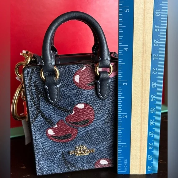 Coach Navy and Burgundy Cherry Print Key Holder - Picture 2 of 15